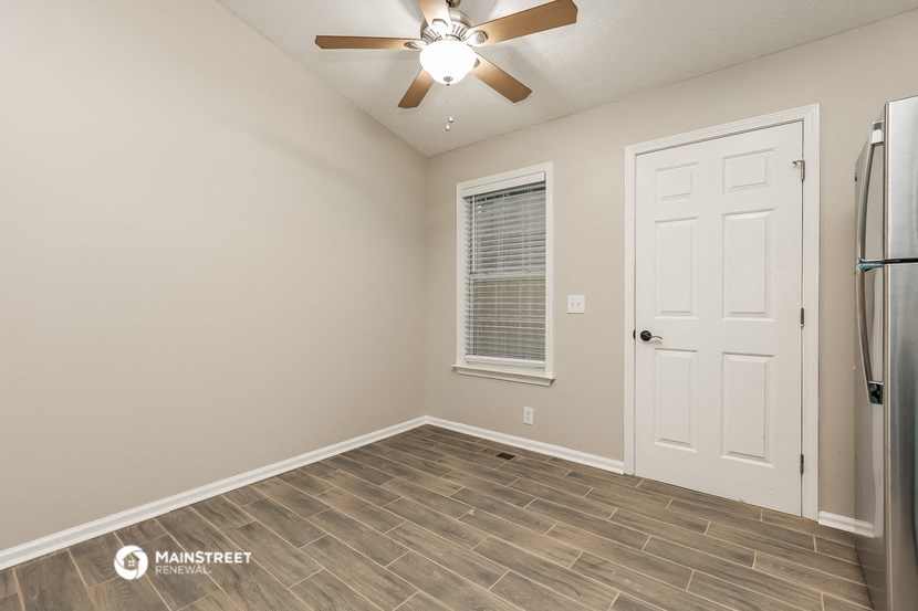 the great room of our manufactured home has a refrigerator and a ceiling fan