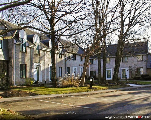 a row of houses on the side of a street