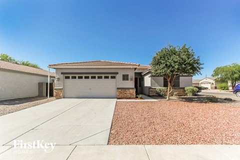 a house with a driveway and a garage door