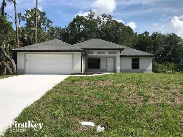a house with a yard and a garage