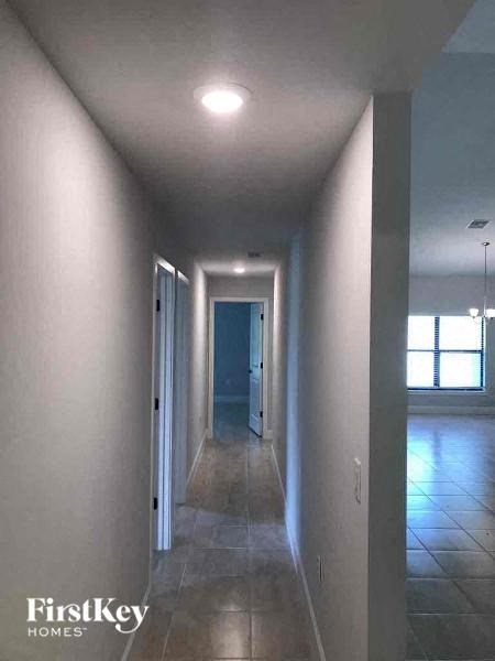 a long hallway with a light on the ceiling