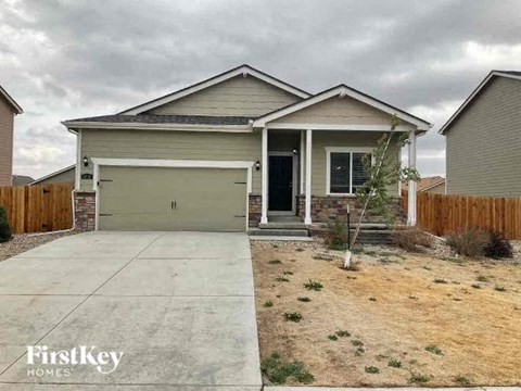 a house with a driveway and a garage door
