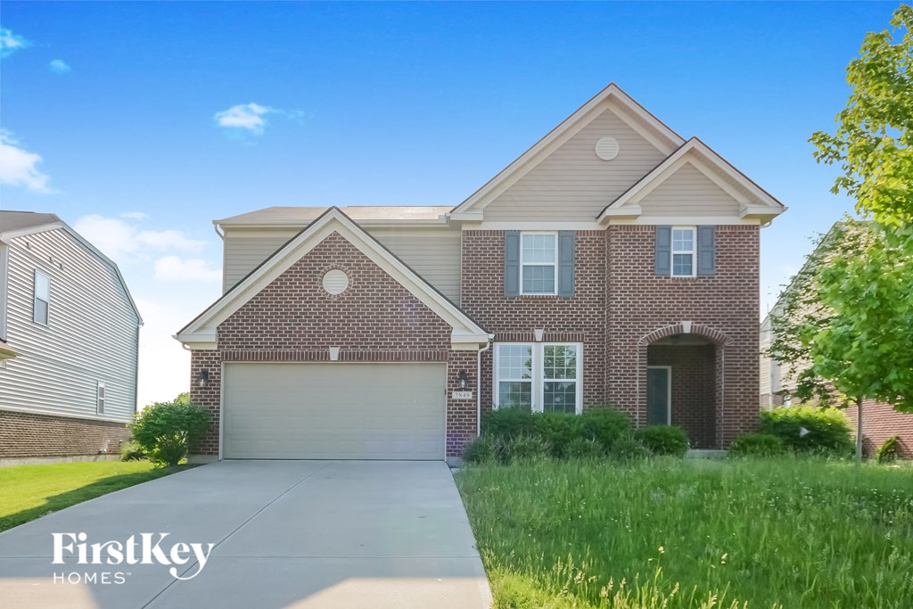 A brick house with a garage is for sale by FirstKey Homes.