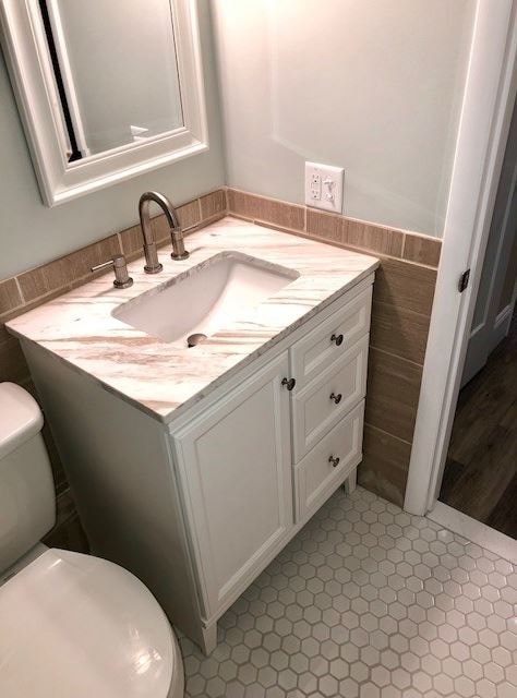 a bathroom with a sink and a toilet