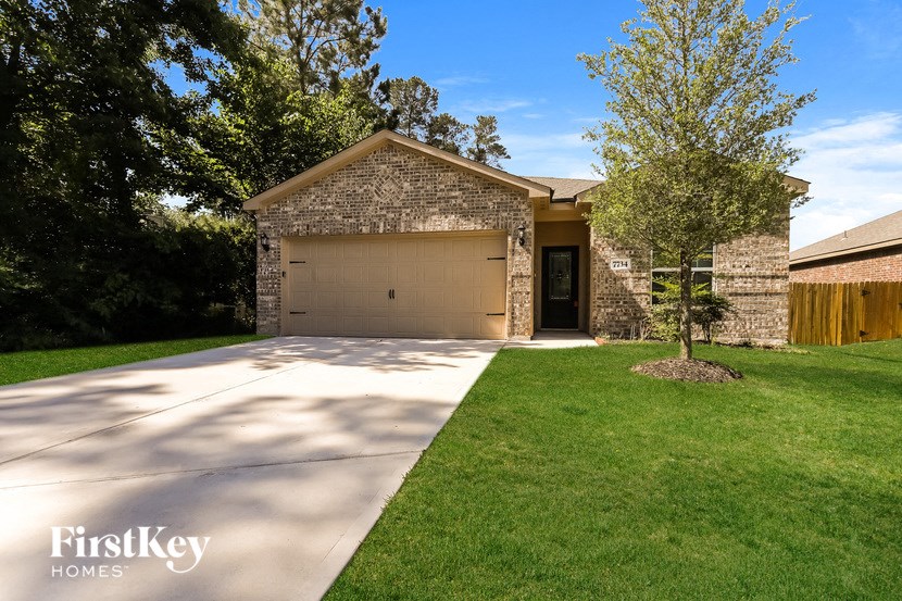 a house with a driveway and a garage door