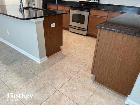 a kitchen with a stove and a counter top