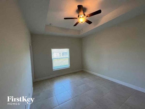 an empty empty room with a ceiling fan