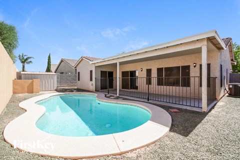 A house with a pool in the backyard.