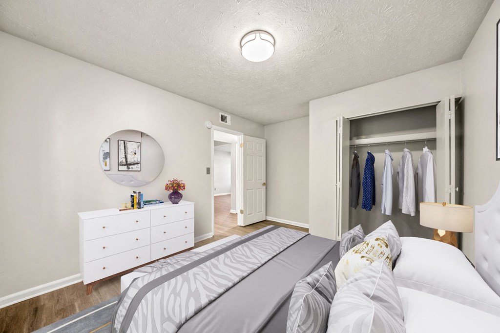 a bedroom with a bed and a closet