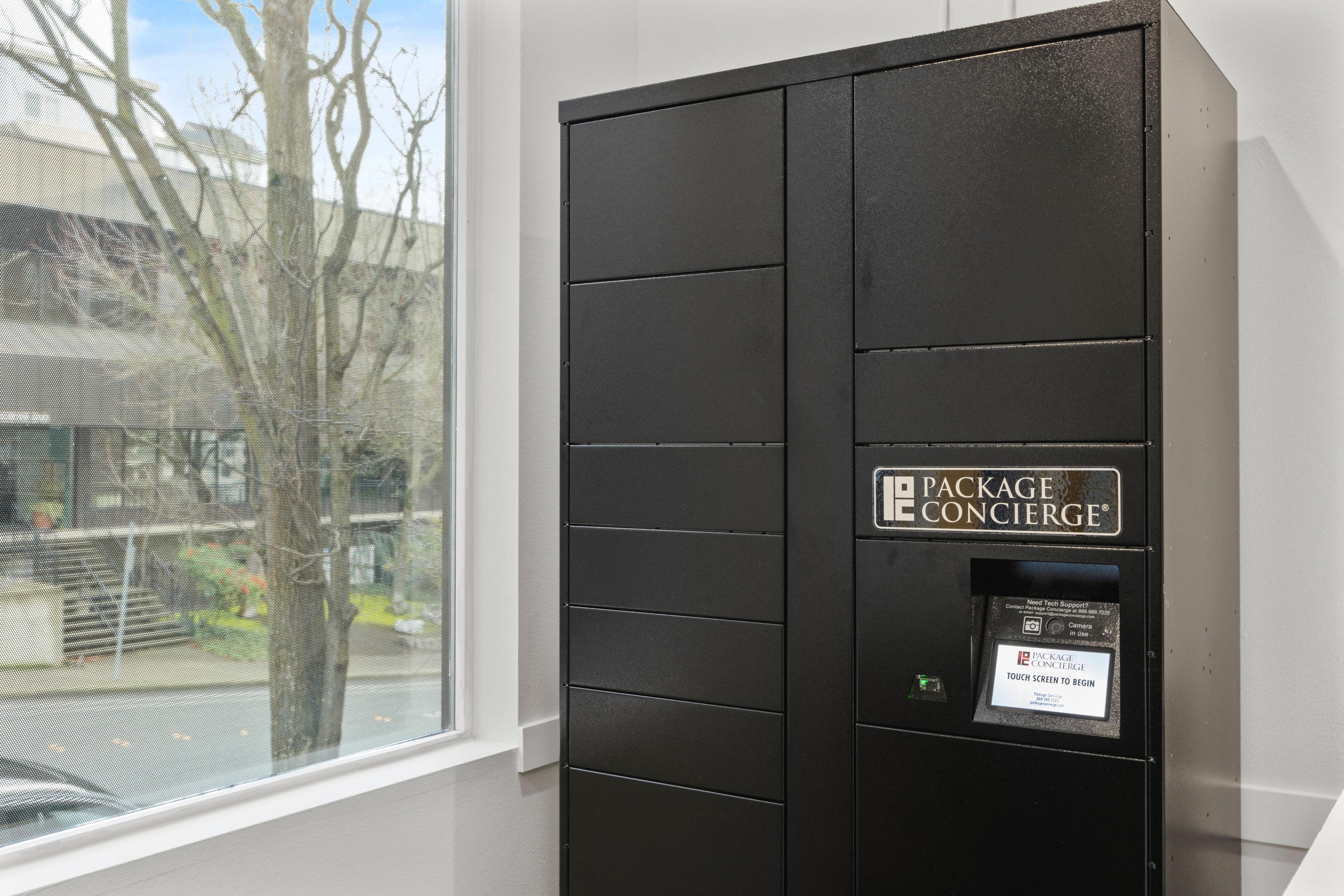 a black locker next to a window in a room