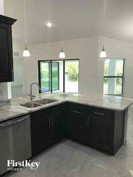 a kitchen with a sink and a counter top