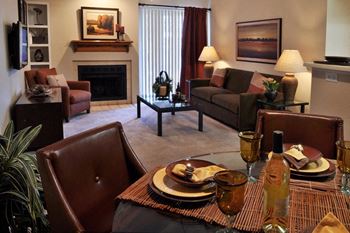 Spacious Living Room with Carpeting and Separate Dining Room Area at 87114 Apartments near Me