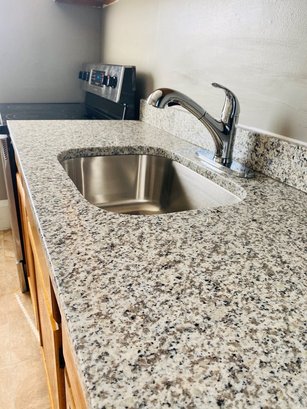 a kitchen with granite counter tops and a sink