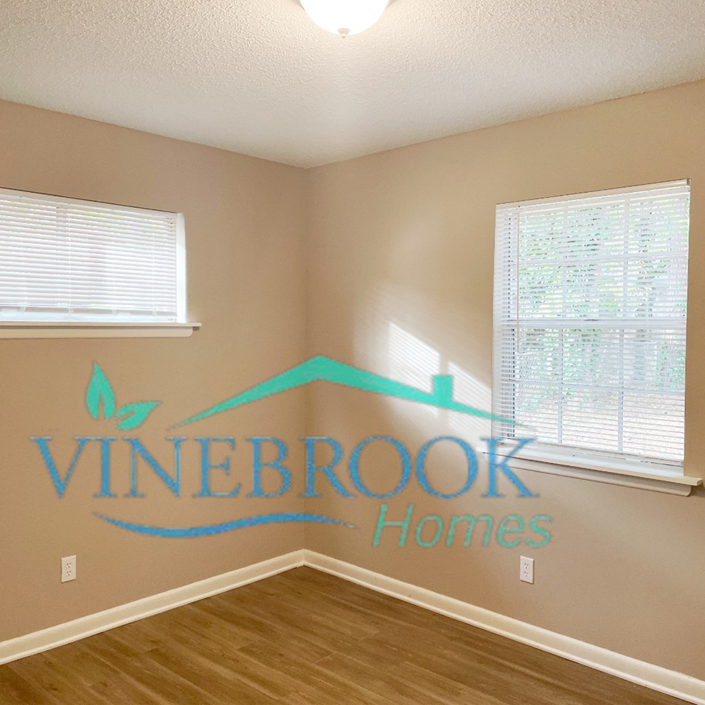 a bedroom with a wall sticker that says vineoor homes