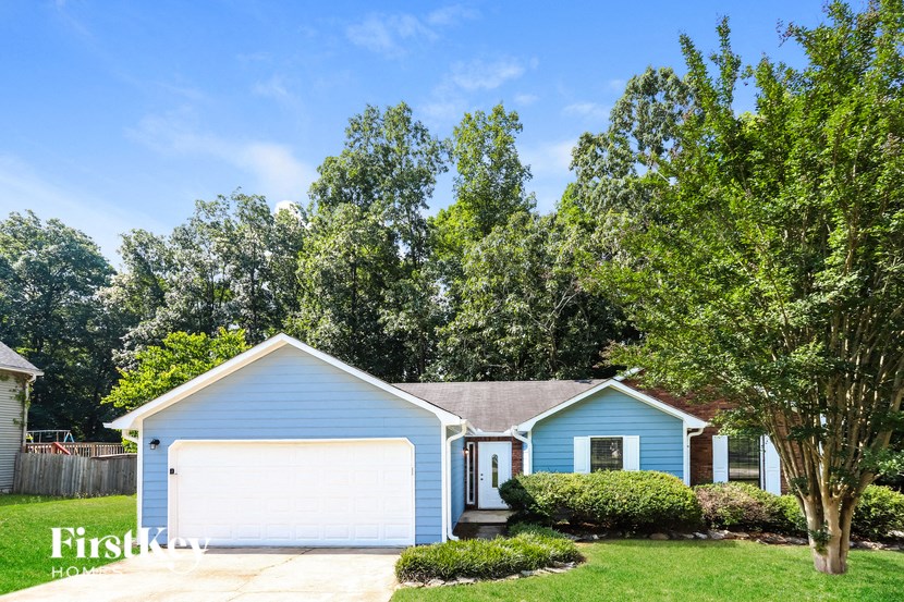 a blue house with a white garage door
