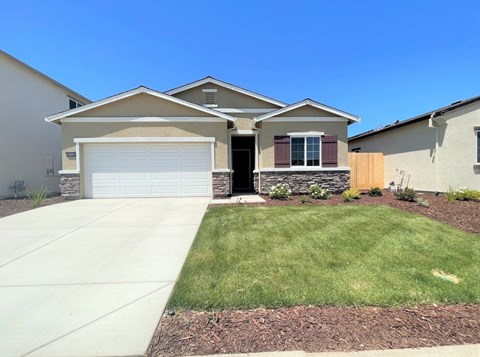 a house with a driveway and a garage door
