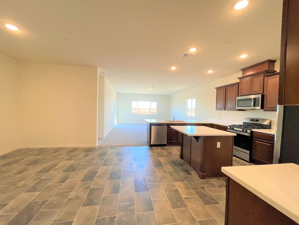 a kitchen and living room with an open floor plan