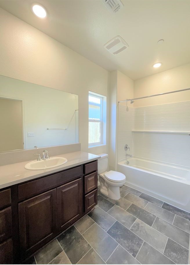 a bathroom with a sink toilet and a bath tub