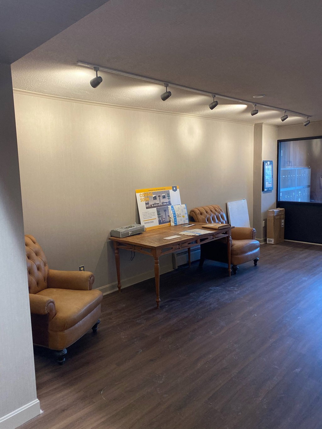 a conference room with a table and chairs and a projector
