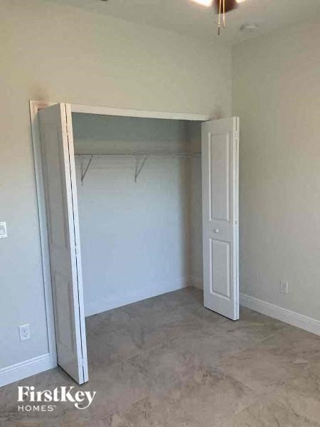 an empty room with a closet and an open door