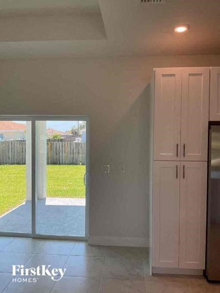 a living room with a sliding glass door and a yard