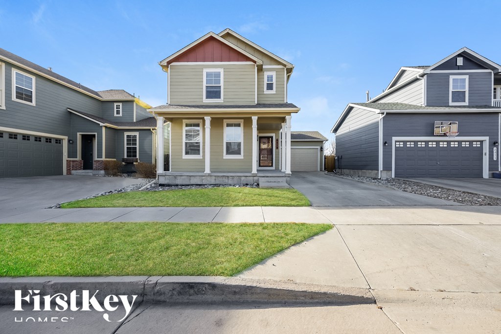A row of houses with a FirstKey logo in the foreground.