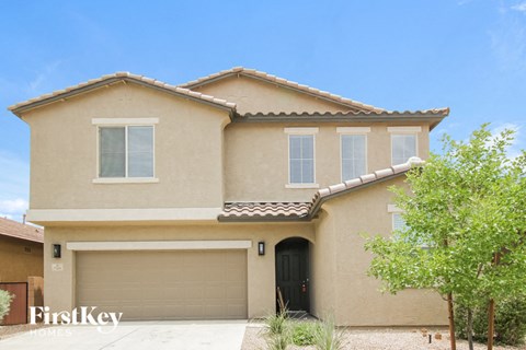 a house with a garage door in front of it