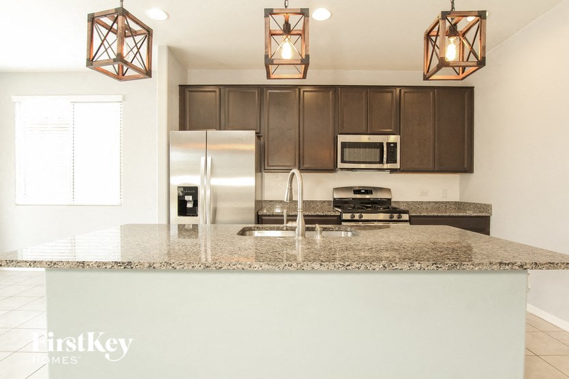 a kitchen with a granite counter top and