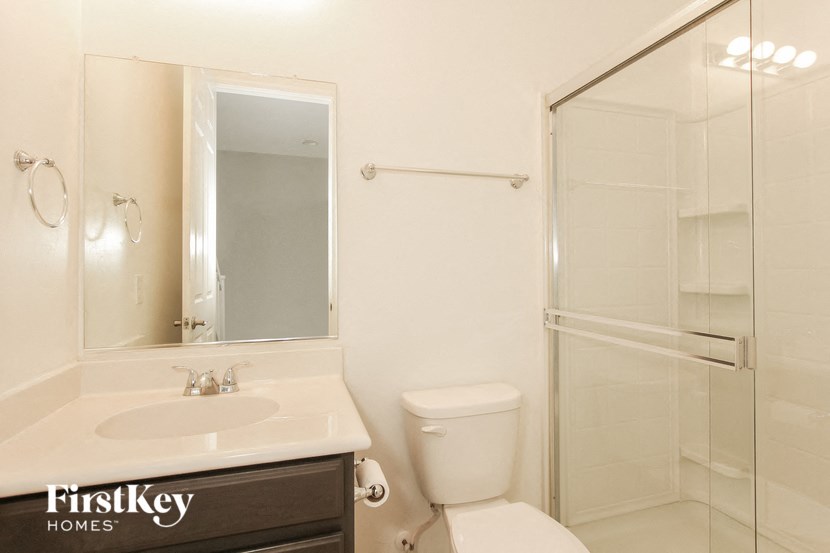 a bathroom with a sink toilet and a shower