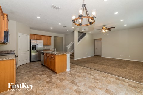 the kitchen and living room are open to the dining room and family room
