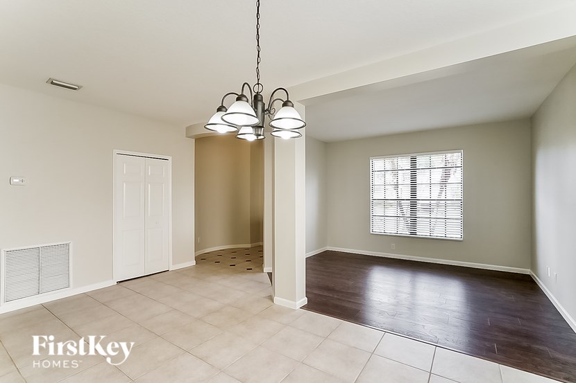 A room with a light fixture hanging from the ceiling.