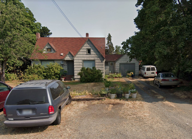 a house with cars parked in front of it