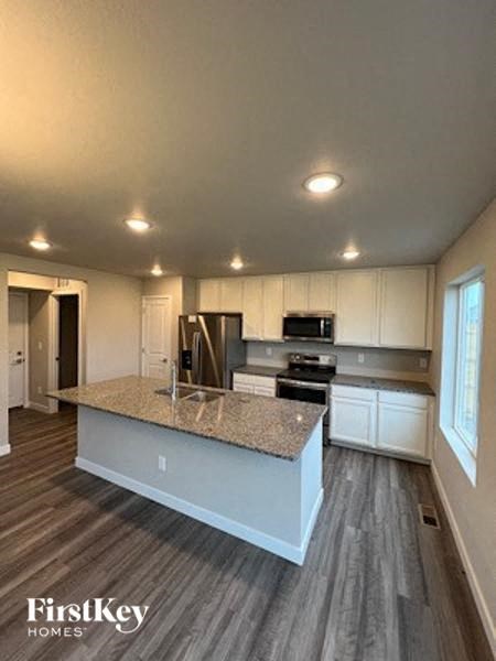 a kitchen with a marble counter top