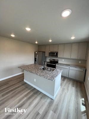 a kitchen with a marble counter top and