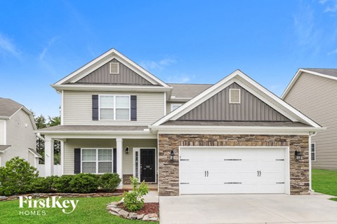 a house with a white garage door in front of it