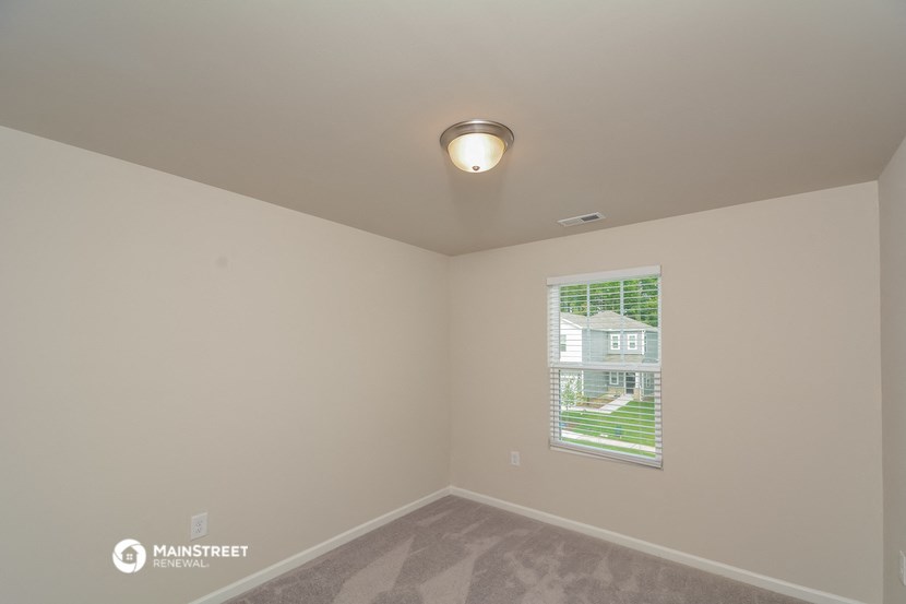 the living room of a manufactured home with a large window