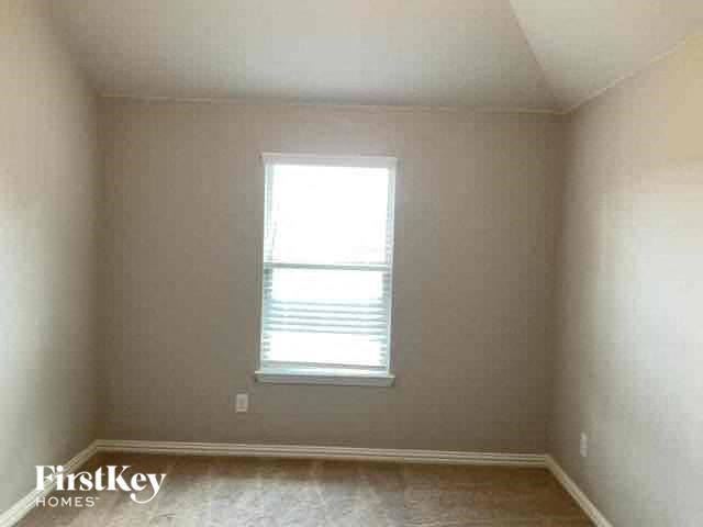 an empty room with a window in it