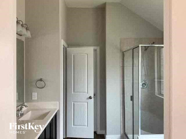 a bathroom with a sink and a shower