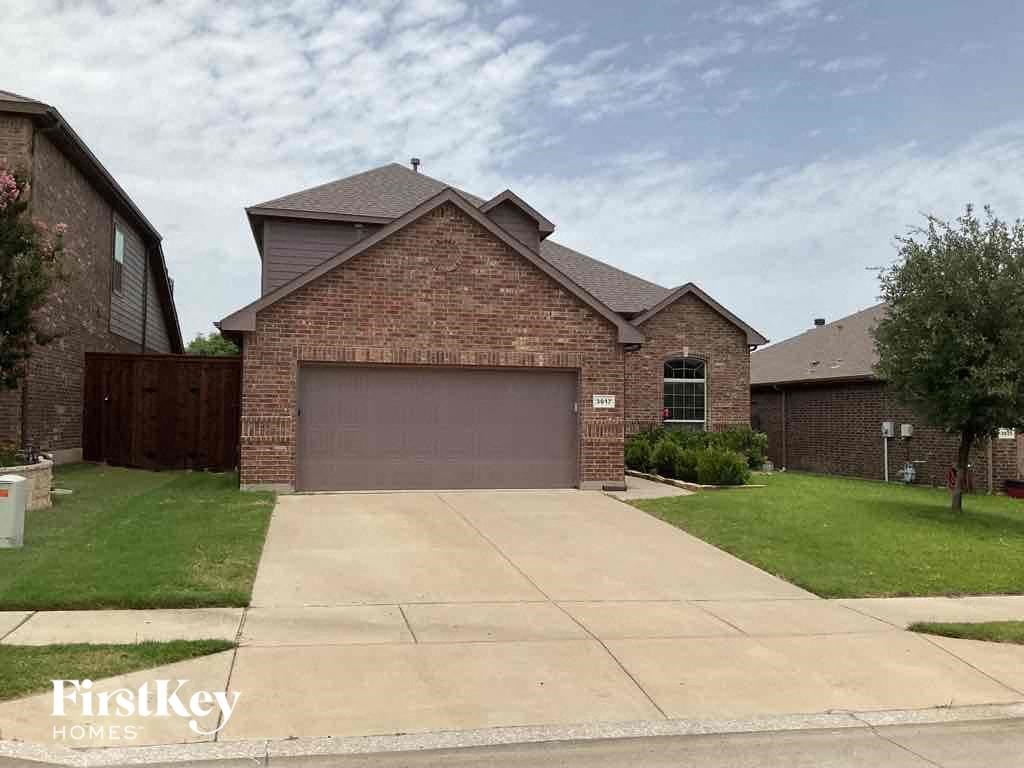 a house with a driveway and a garage door