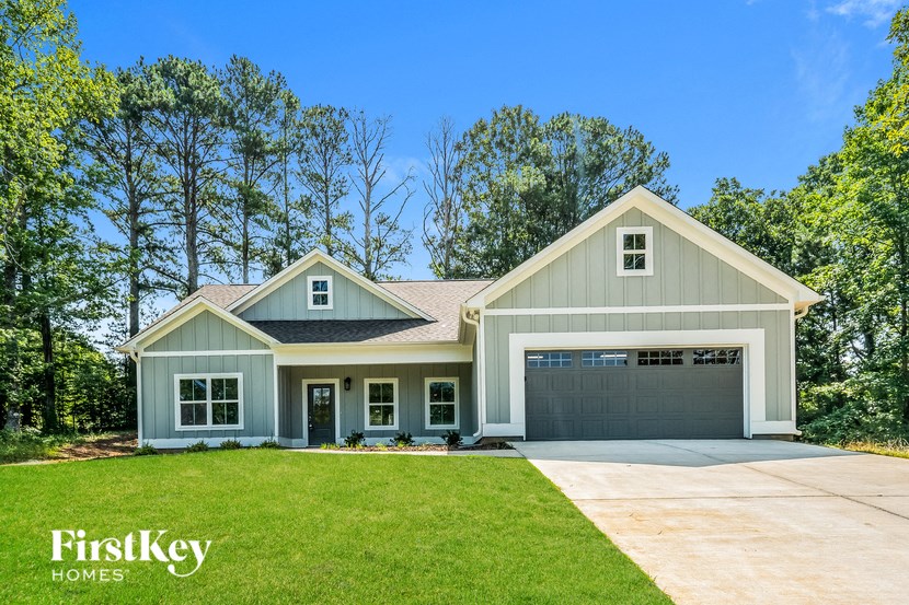 a house with a driveway and a garage door