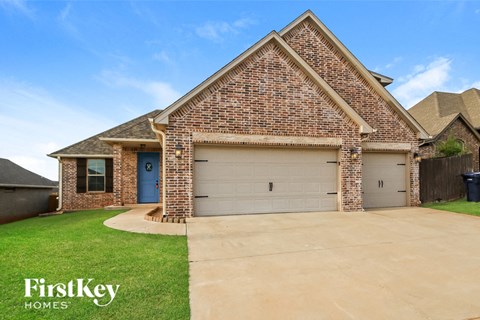 a house with a driveway and a garage door