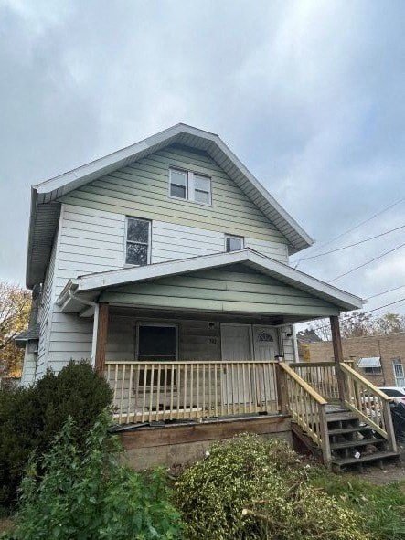 A house with a porch and a window.