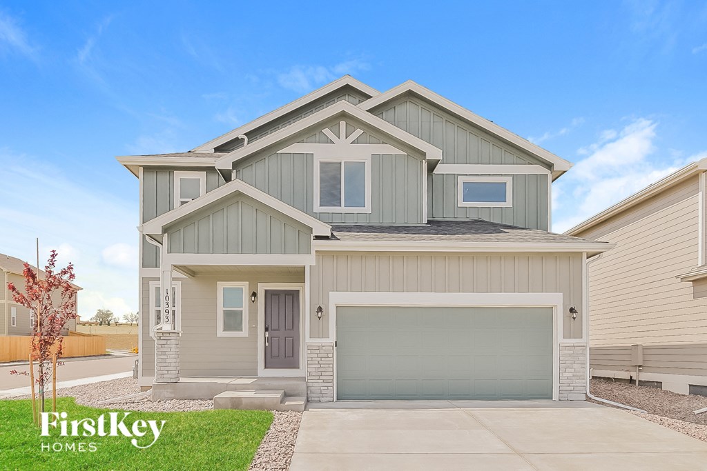 A modern two-story house with a garage is for sale by FirstKey Homes.