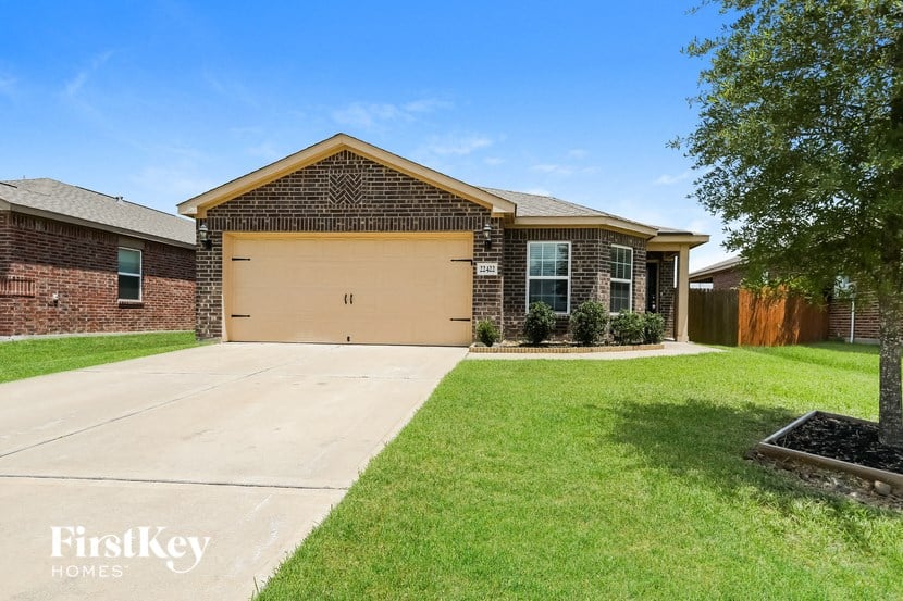 a house with a driveway and a garage door