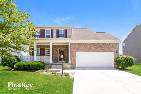 a house with a white garage door in front of it