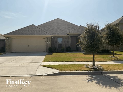 a house with a driveway and a garage door