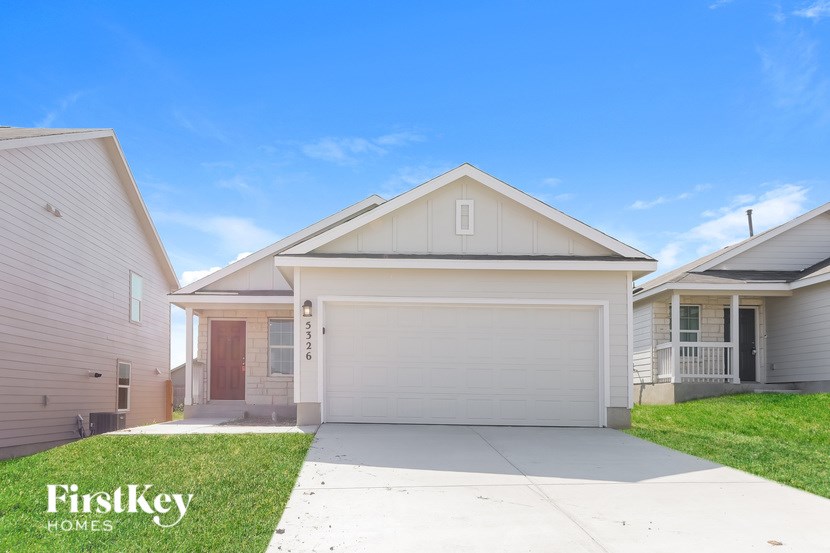 A house with a garage is for sale by FirstKey Homes.