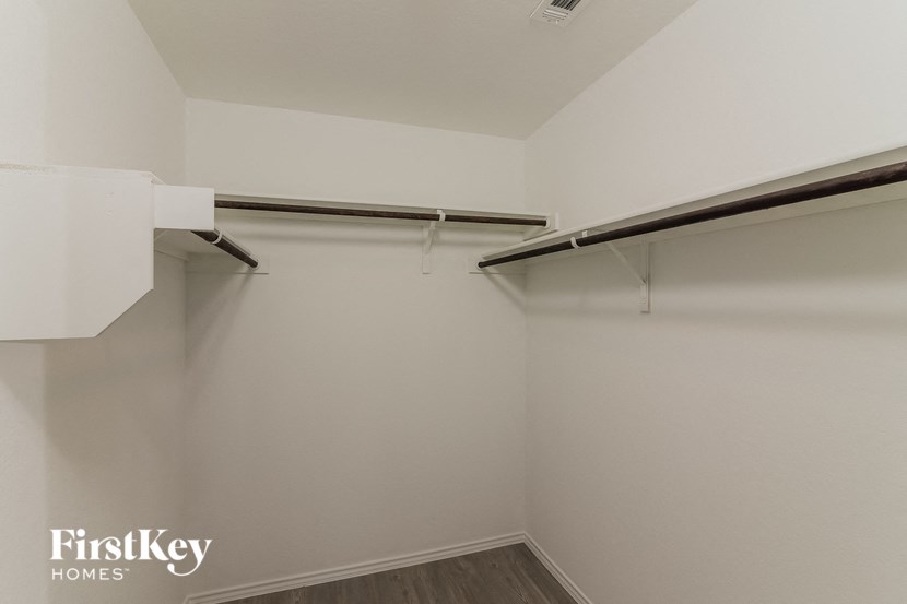 the closet in the master bedroom of this 2500 sq ft home is empty