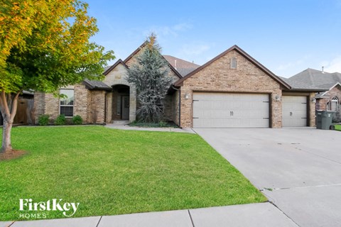 a house with a garage and a lawn