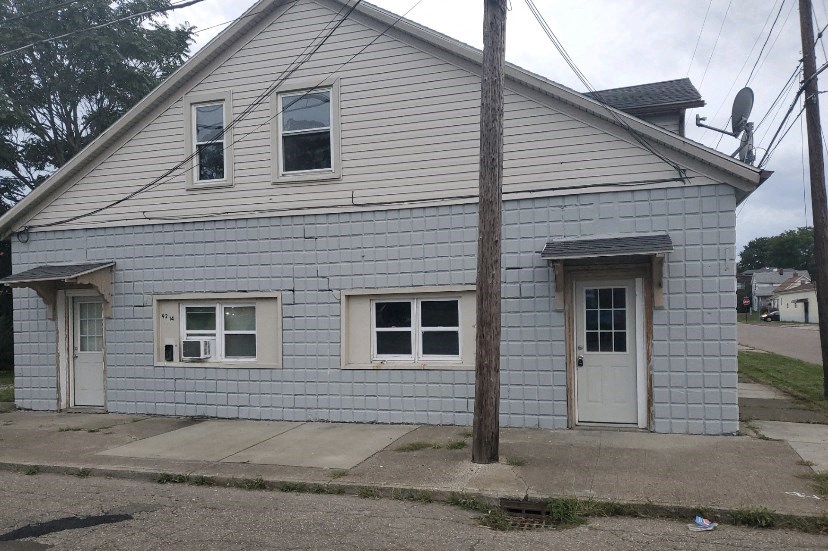 a white house with a white door and windows